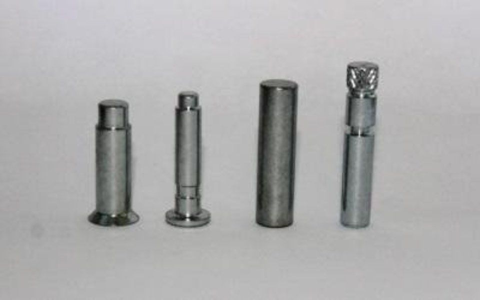 Four products from a supplier of precision metal small parts in Turin