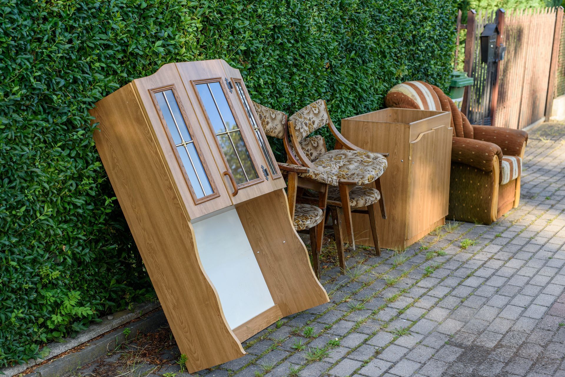 a bunch of furniture is sitting on the side of the road .