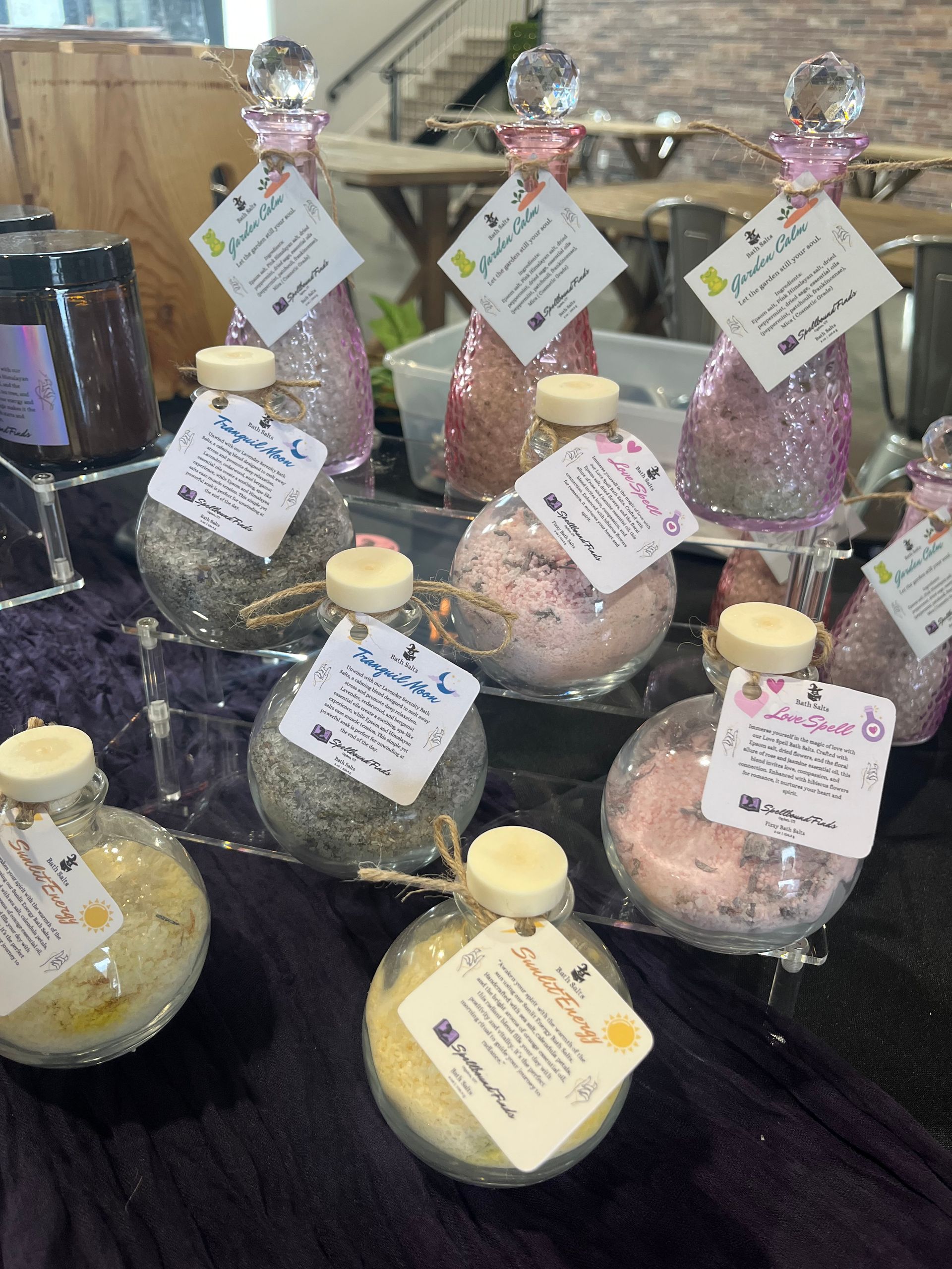 Several bottles of bath salts are sitting on a table
