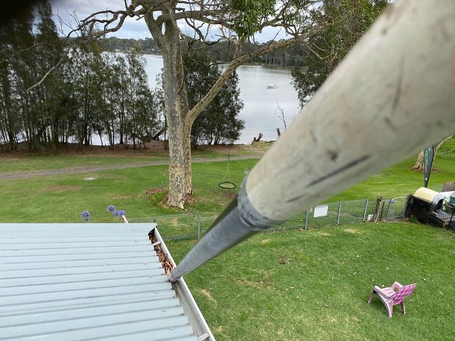 A Close Up Of A Gutter On The Roof Of A House — Gutter Cleaning In Shoalhaven, NSW