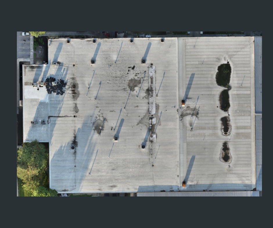 Drone performing a thermal roof inspection on a commercial building in Cincinnati to detect heat loss and water damage