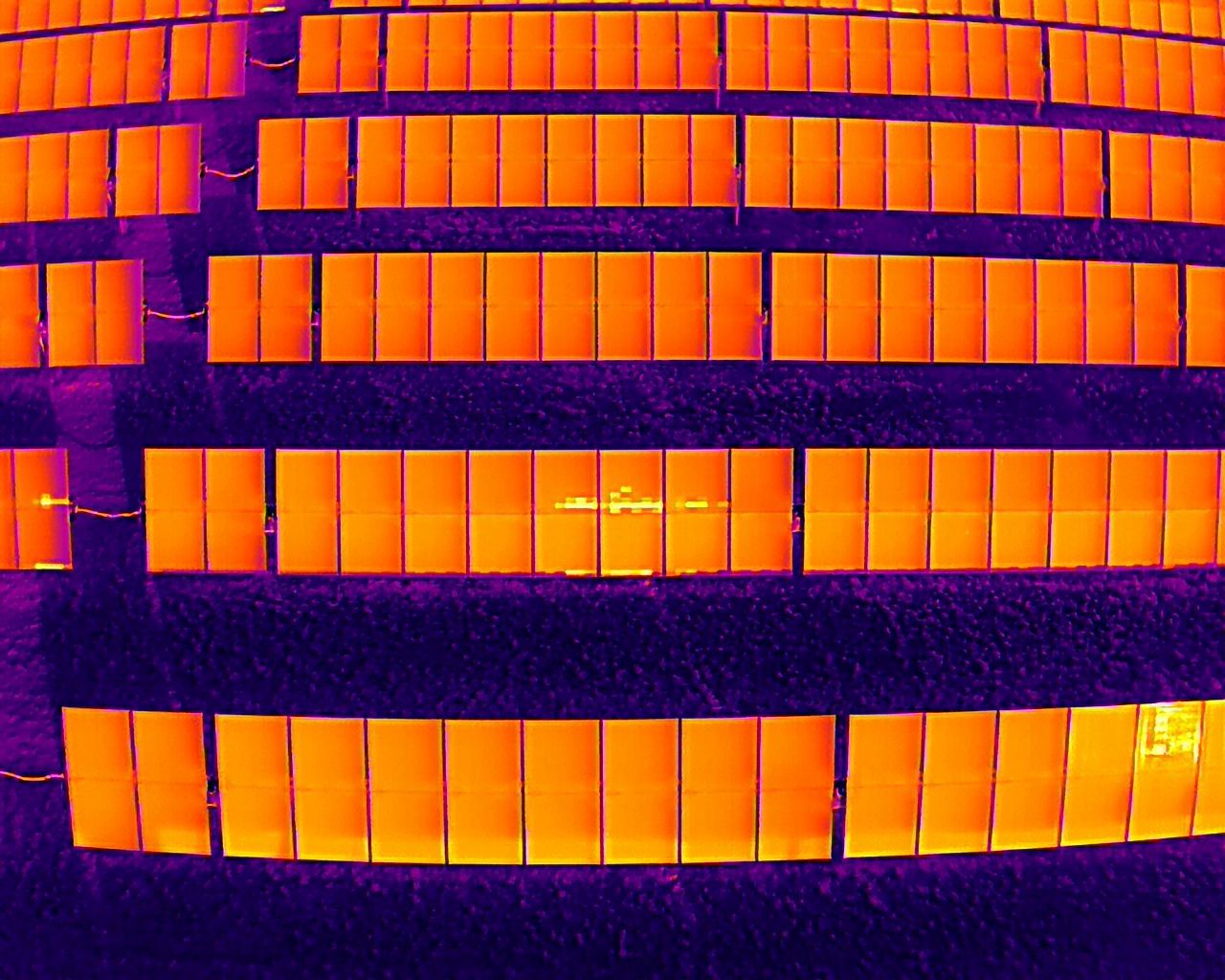 thermal drone inspection of solar panels showing anomalies in the solar panels 