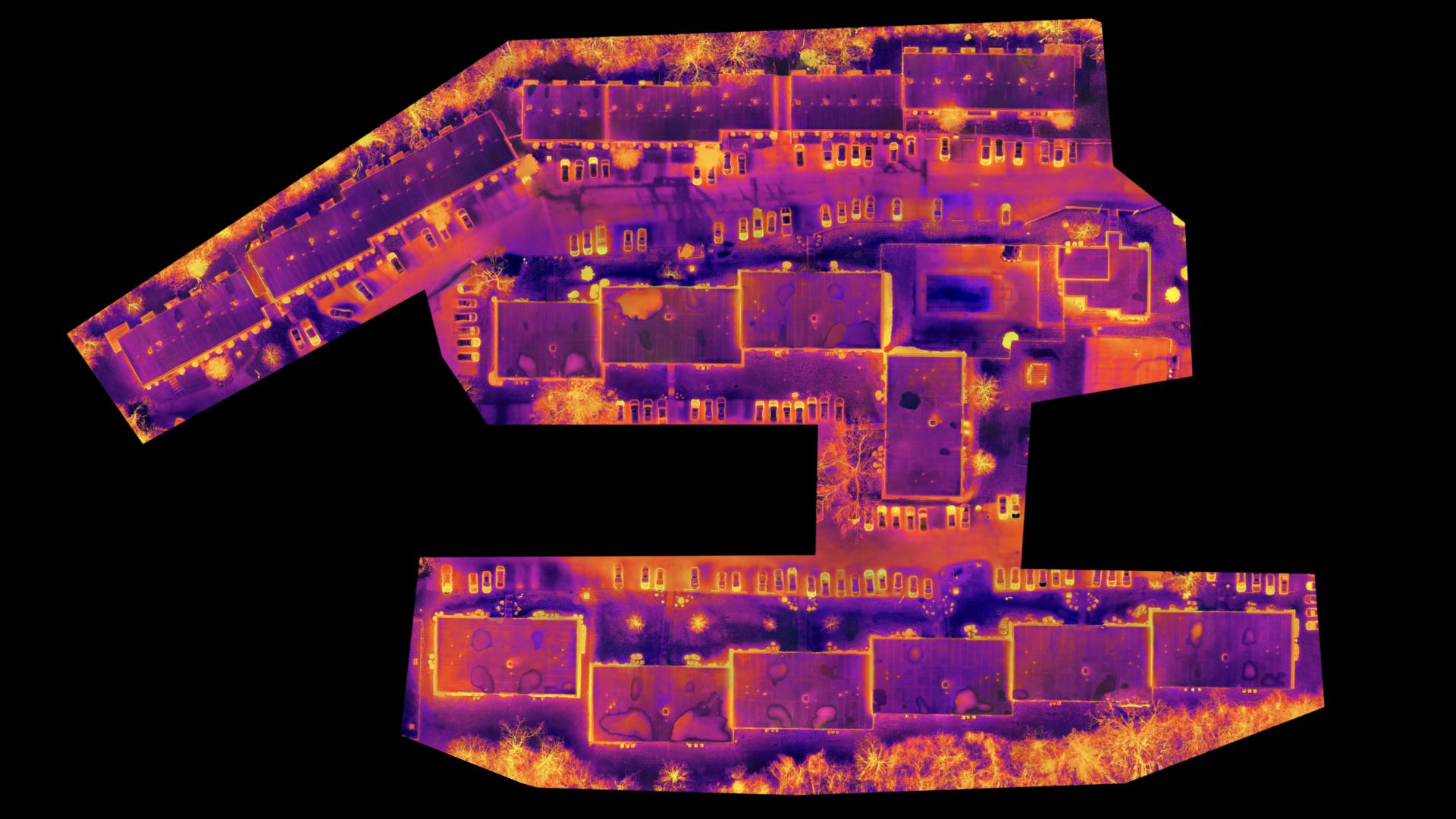 A purple and orange aerial view of a building with a black background.