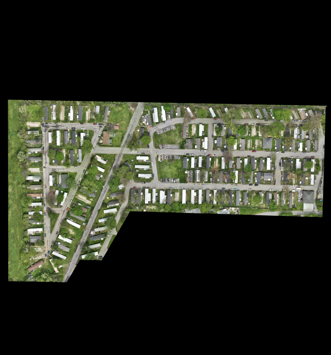 An aerial view of a residential area with lots of houses and trees.
