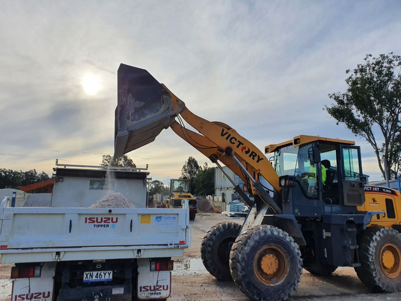 Excavator Loading Sand To Truck — Truck Hire in Port Macquarie, NSW