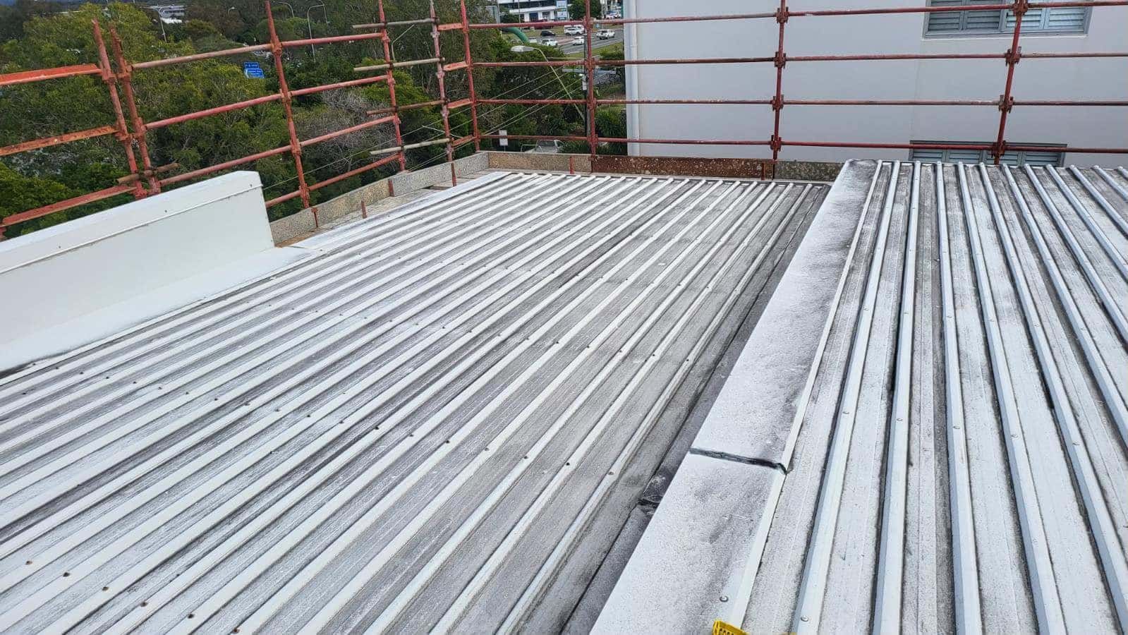 The roof of a building is being built and there is a fence in the background. — Roofing Gold Coast in Tallebudgera, QLD