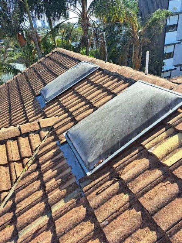 There are two skylights on the roof of a house. — Roofing Gold Coast in Tallebudgera, QLD