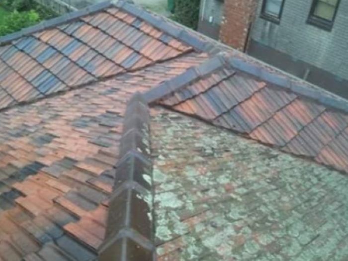 A Tiled Roof With a Chimney on the Side of It — Roofing Gold Coast in Tallebudgera, QLD