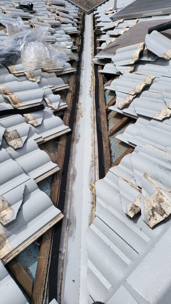 A Gutter Between Two Roofs of a Building — Roofing Gold Coast in Tallebudgera, QLD