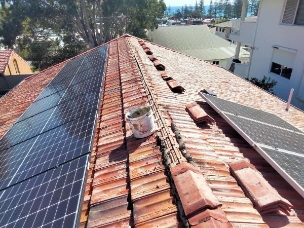 A Roof With a Bunch of Solar Panels on It — Roofing Gold Coast in Tallebudgera, QLD