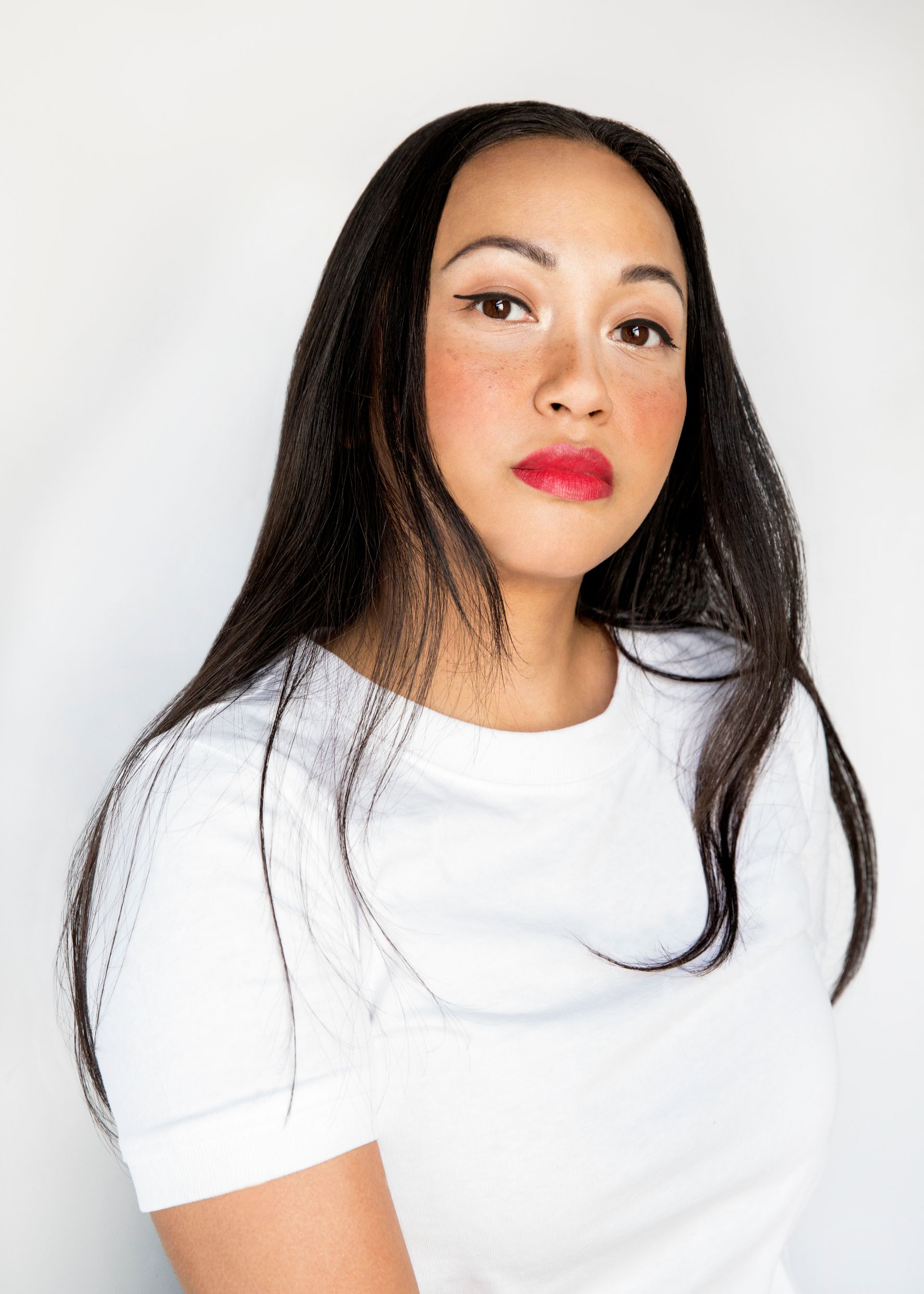 asian woman with long black hair and red lipstick