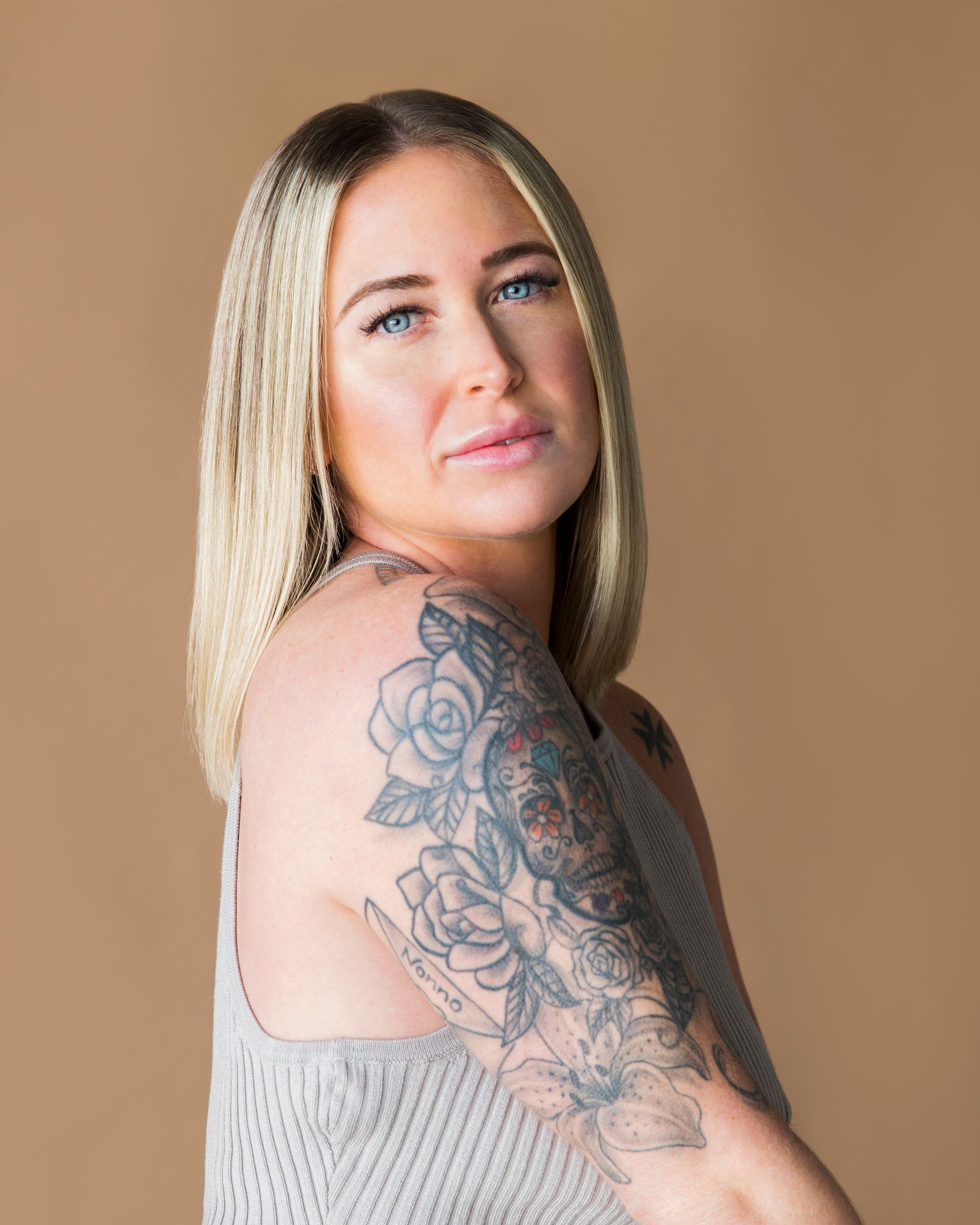 white woman with tattoos on arm