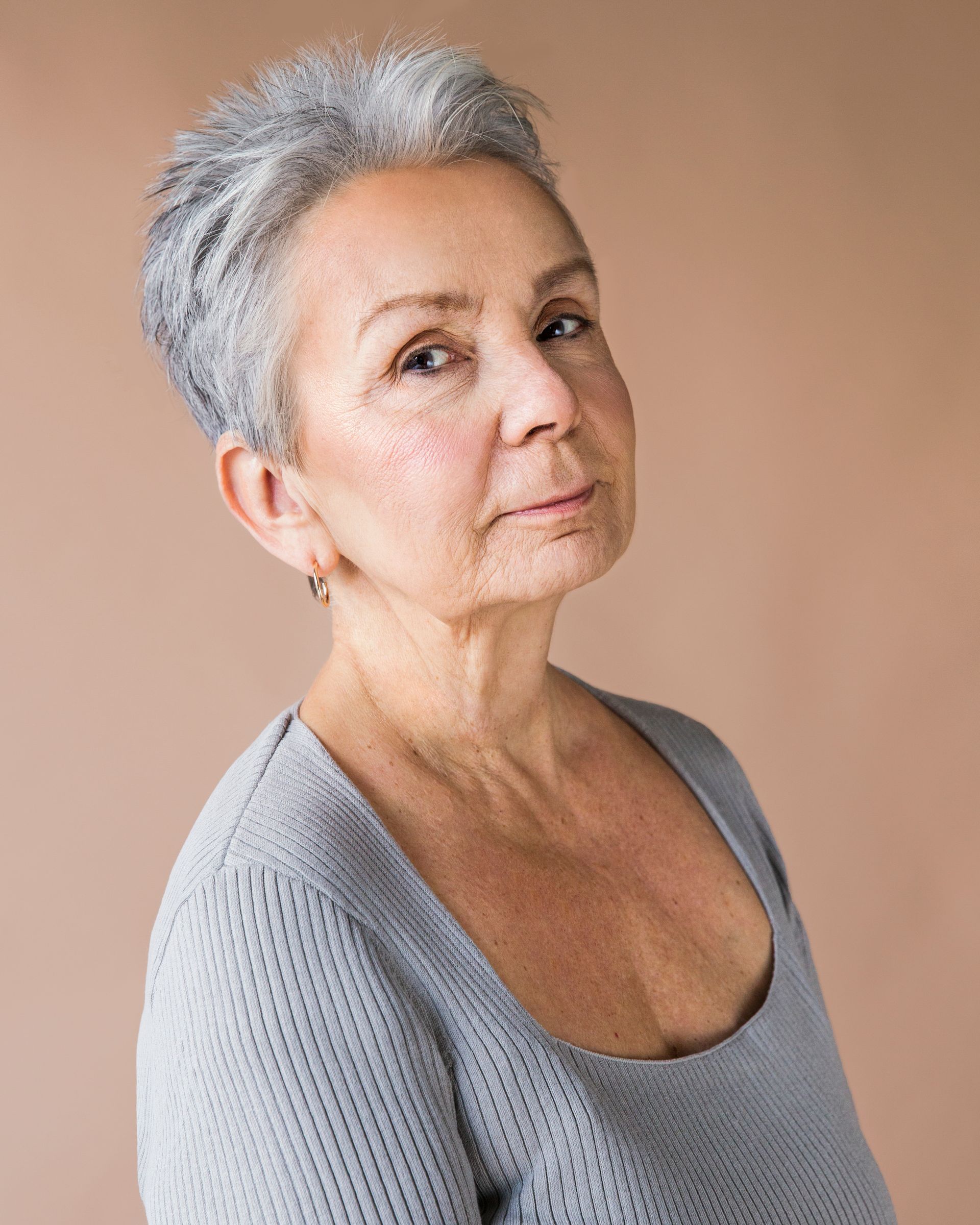 headshot of middle aged woman with grey hair