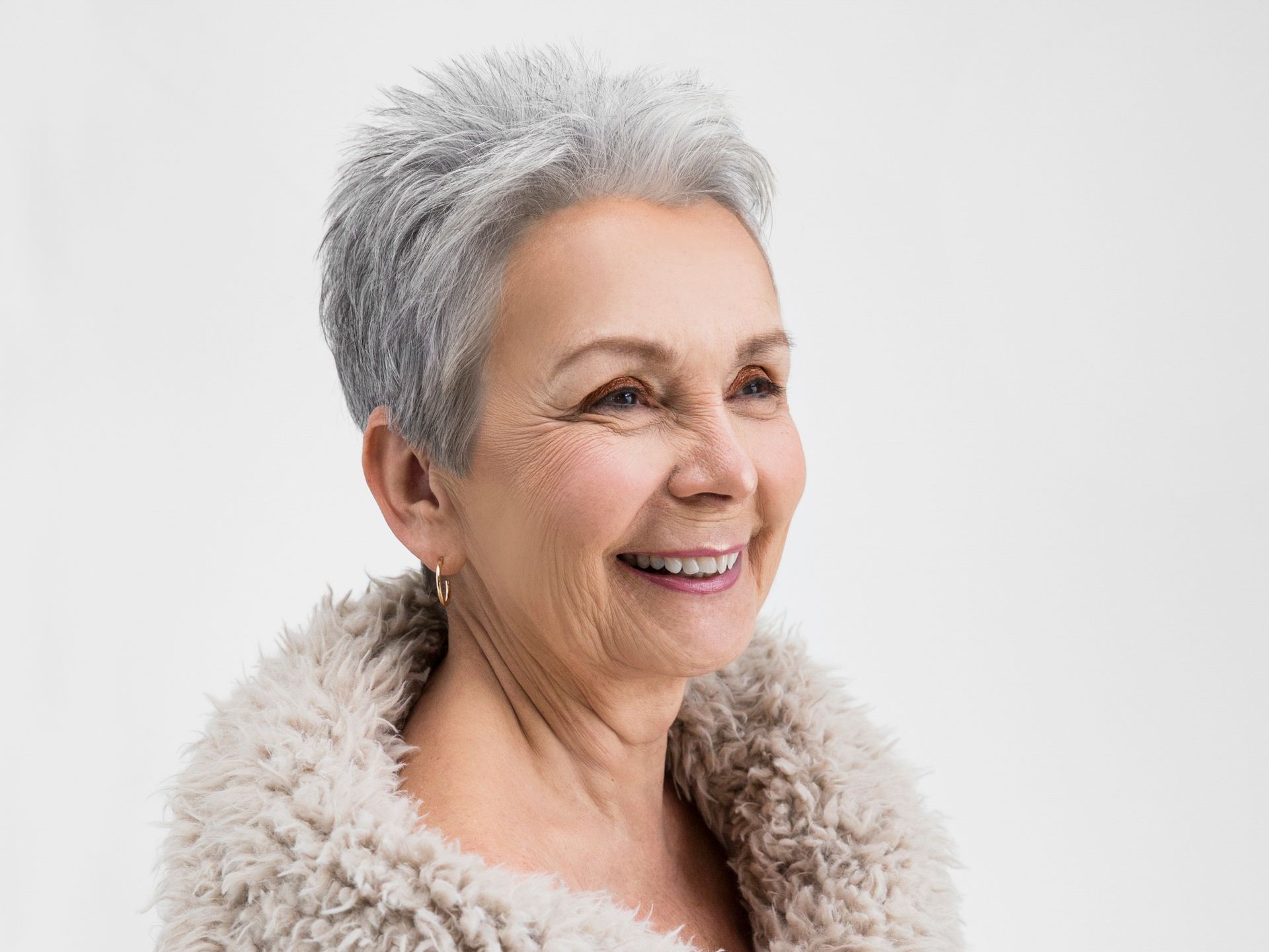 elder lady with grey hair smiling
