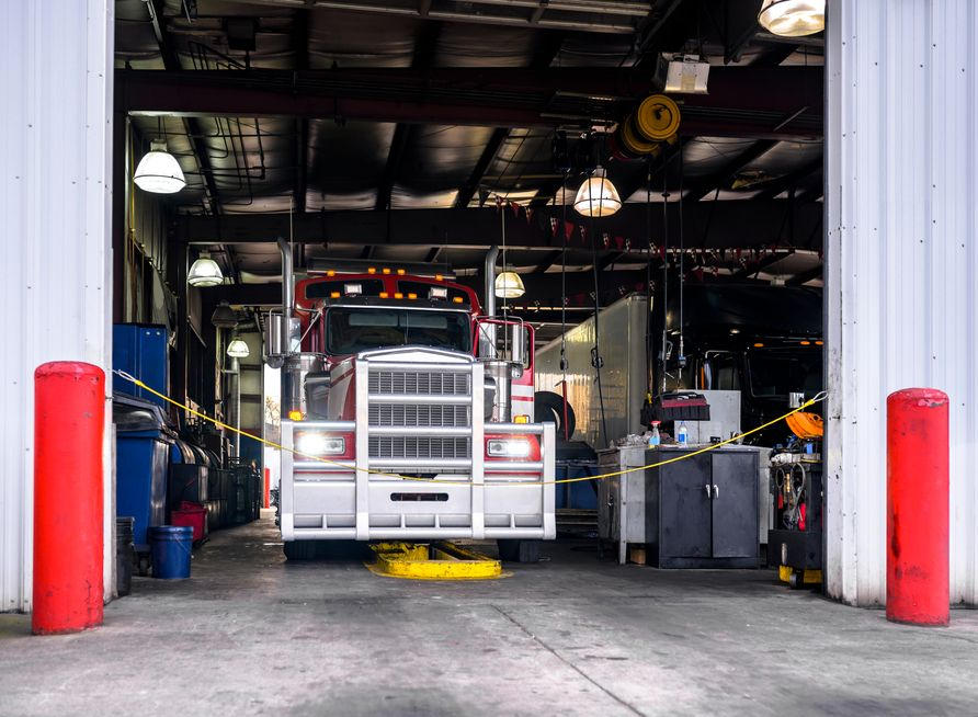 Semi-truck Inside a Garage With Red Support Beams — COD Automotive in Ashmont, NSW