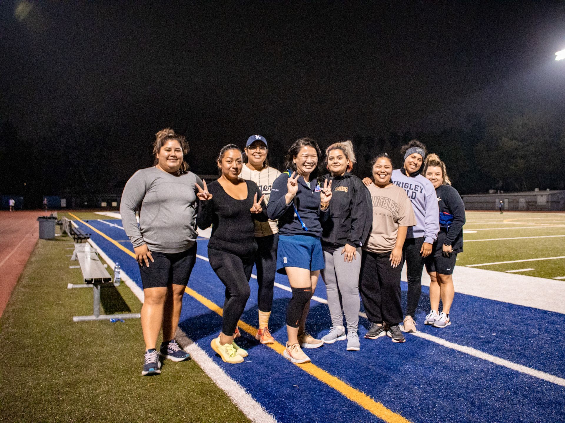 group of runners posing for camera