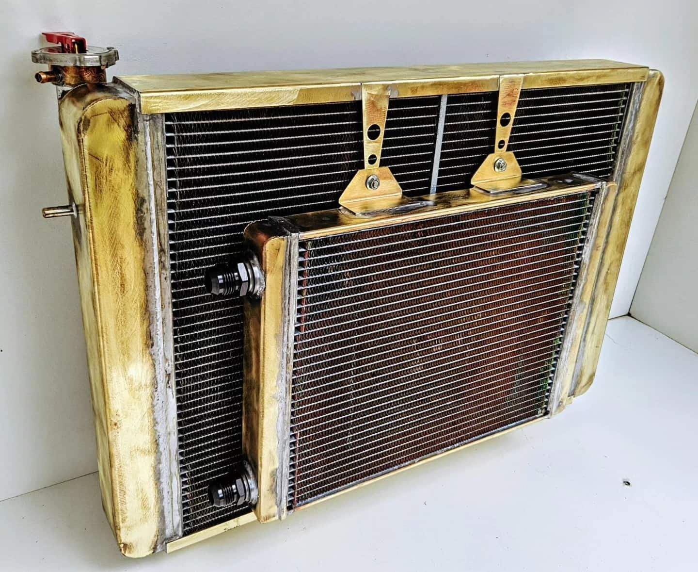 A Brass Radiator is Sitting on a White Surface — South Coast Radiators In Liverpool, NSW