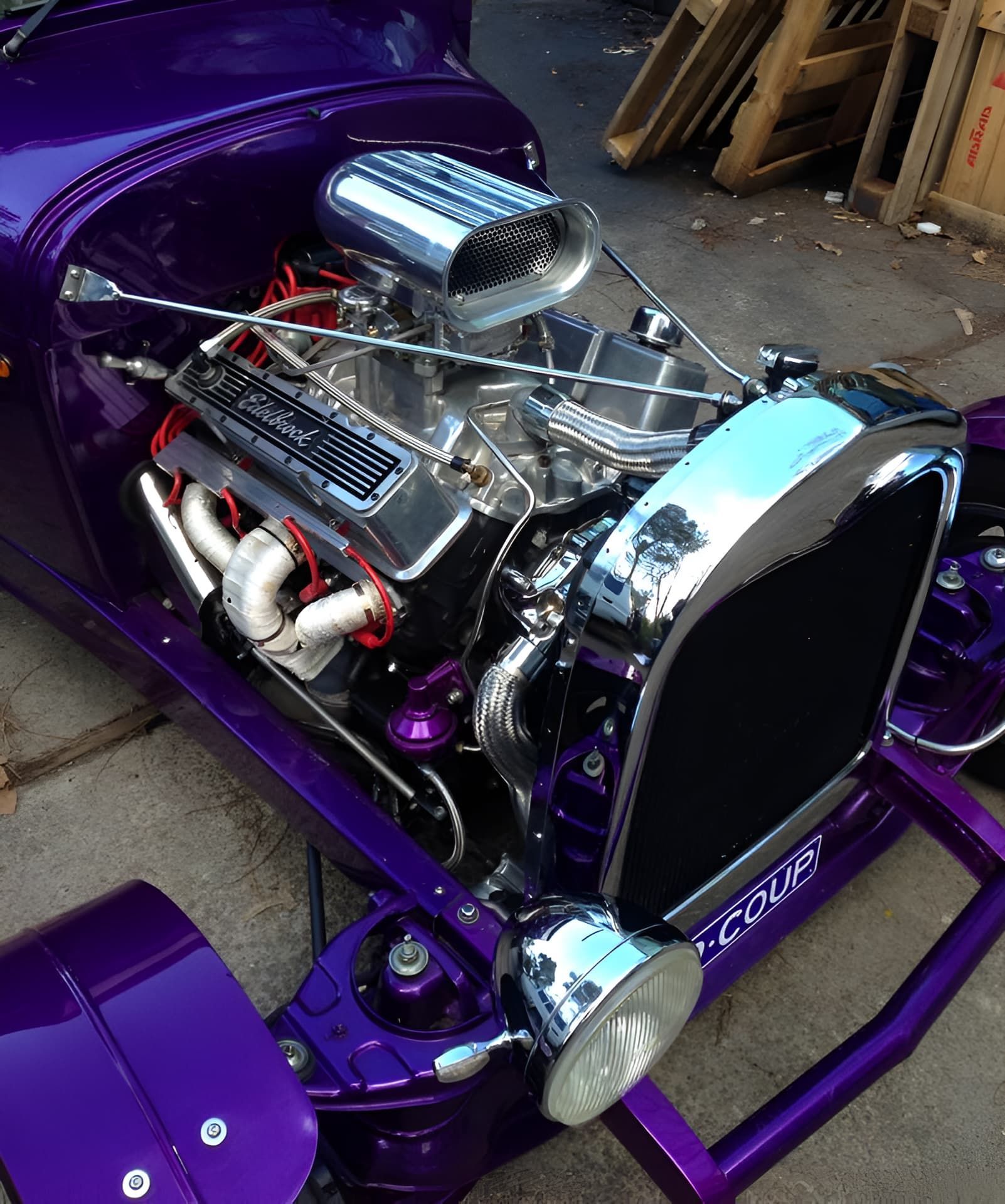 A Purple Car With a Chrome Engine is Parked on the Side of the Road — South Coast Radiators In Campbelltown, NSW