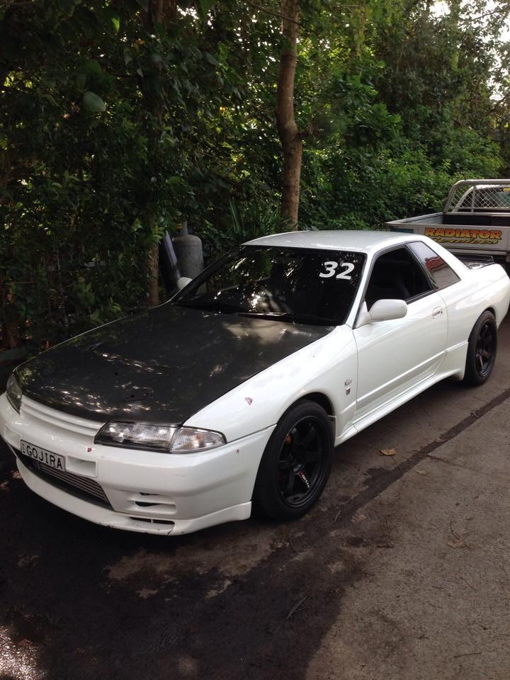 A White Car is Parked on the Side of the Road — South Coast Radiators In Campbelltown, NSW