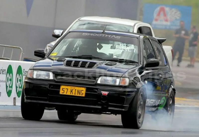 A Black Car With a License Plate — South Coast Radiators In Penrith, NSW