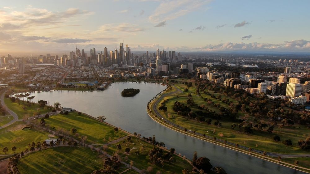 An Aerial View of a Lake With a City Skyline — South Coast Radiators In Melbourne, VIC