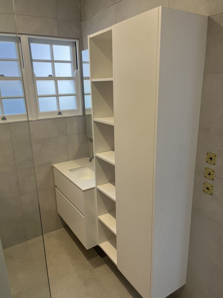 A Bathroom With a Sink, Shelves and a Window — D Hinged Kitchens & Joinery in Main Arm, NSW