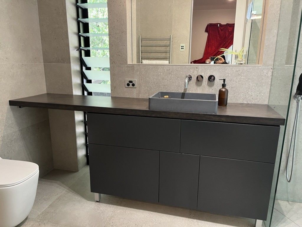 A Bathroom With a Sink, Toilet and Mirror — D Hinged Kitchens & Joinery in Main Arm, NSW