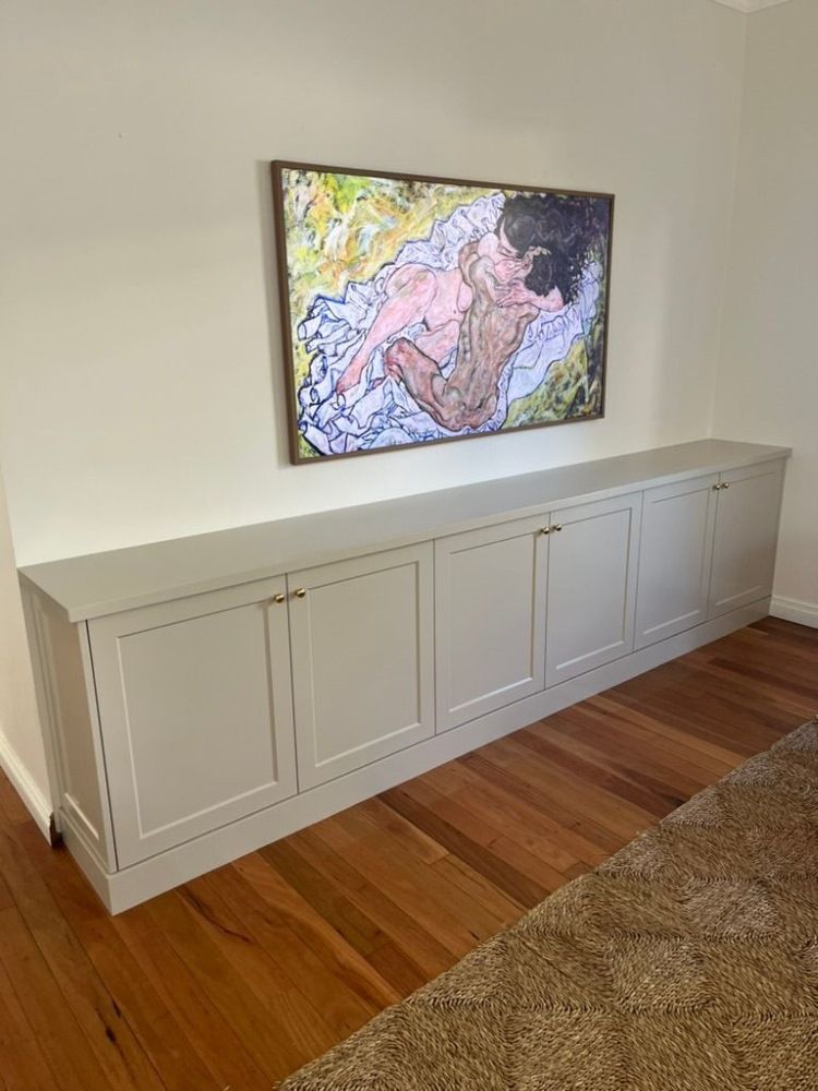 There is a Painting on the Wall Above the Cabinets — D Hinged Kitchens & Joinery in Main Arm, NSW