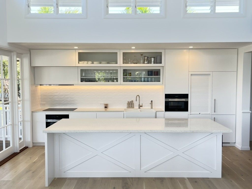 A Kitchen With White Cabinets and a Large Island in the Middle — D Hinged Kitchens & Joinery in Ocean Shores, NSW