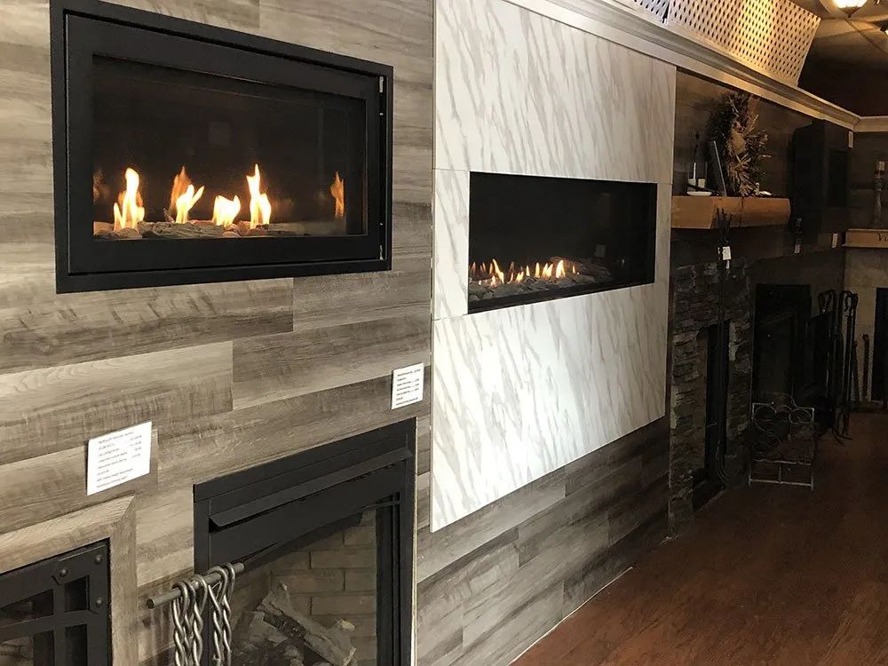 There are two fireplace displays in the room.