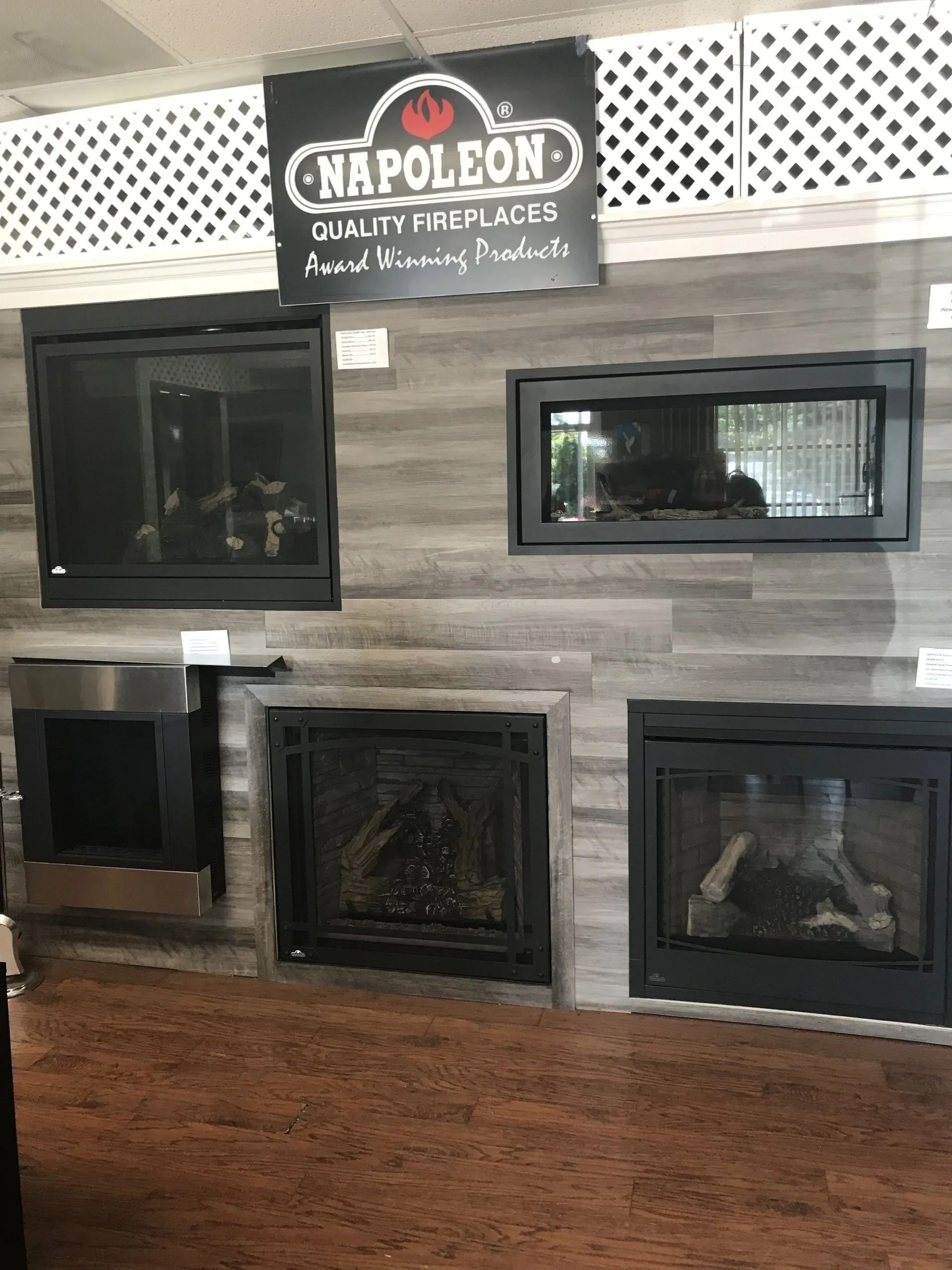A napoleon fireplace is displayed in a showroom.