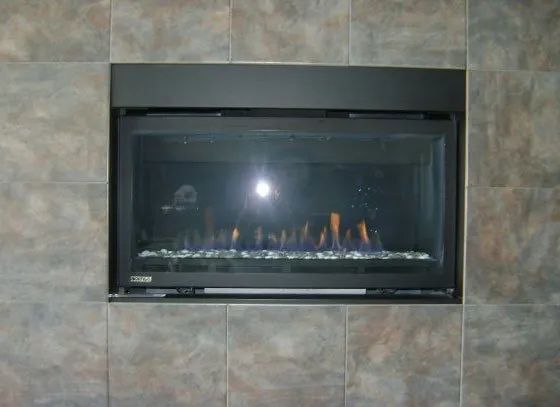 A fireplace with flames coming out of it