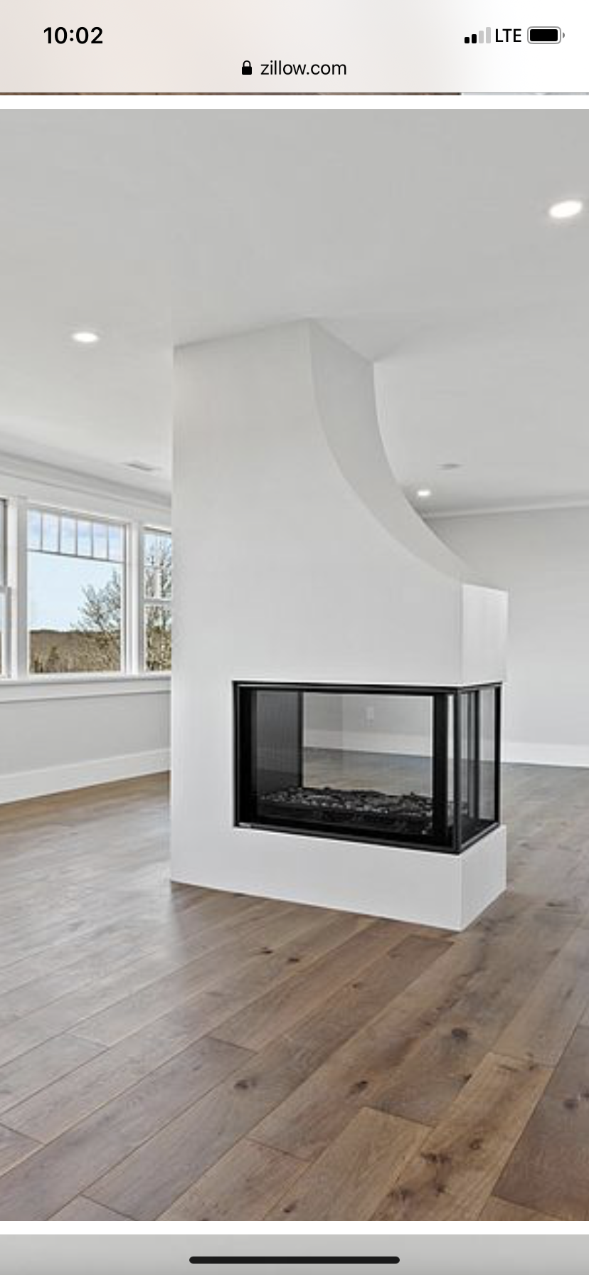 There is a fireplace in the middle of the room.