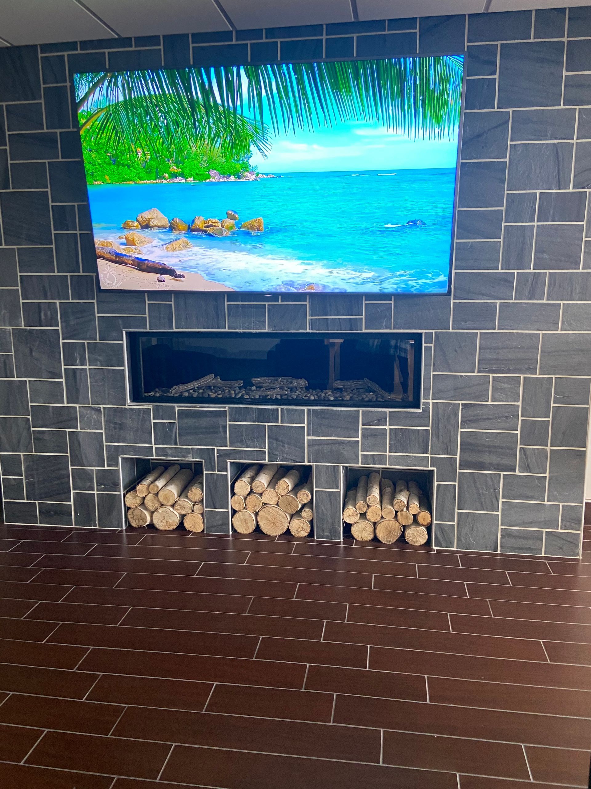 A fireplace with a flat screen tv above it