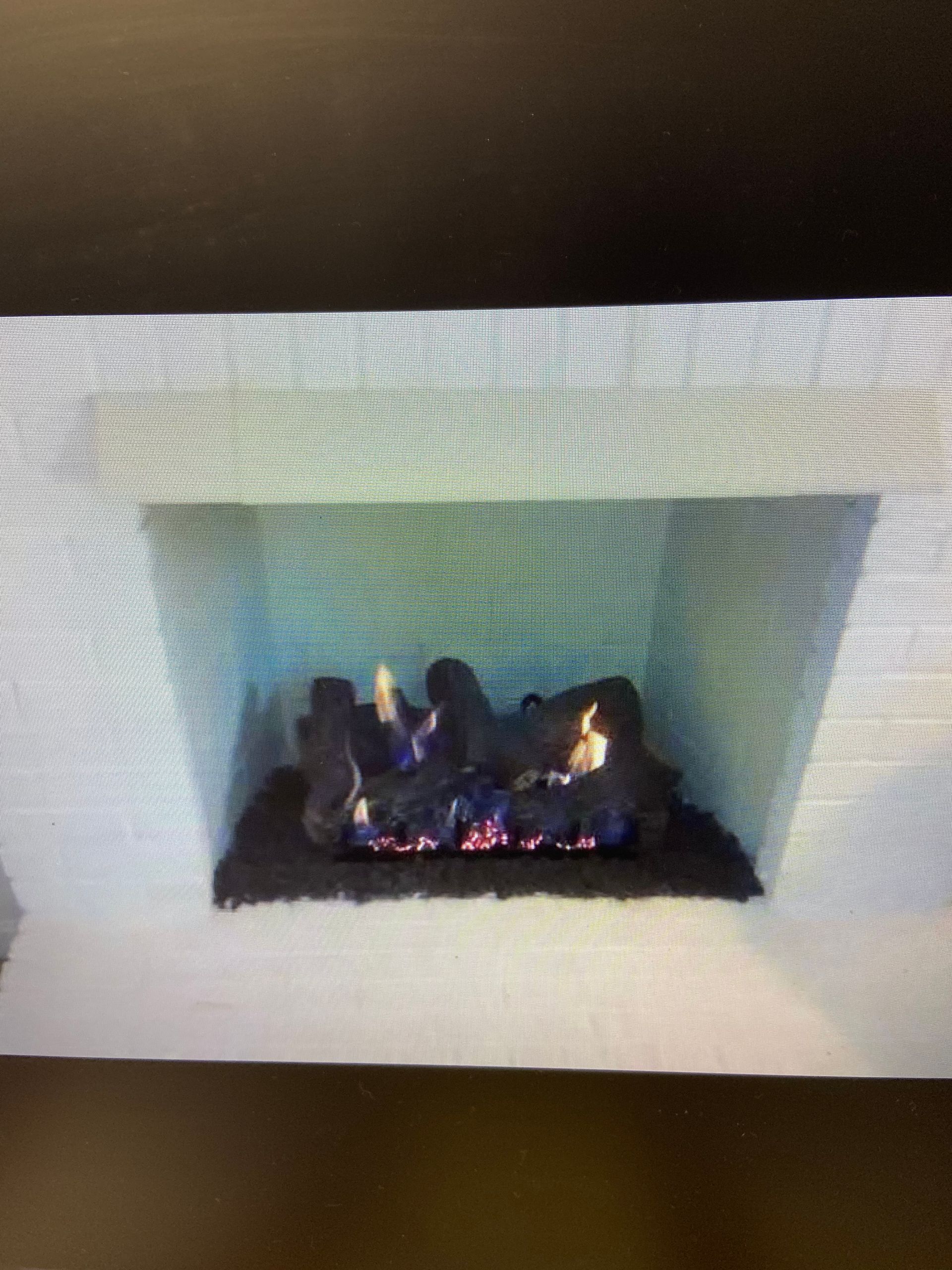 A fireplace with a lot of logs in it