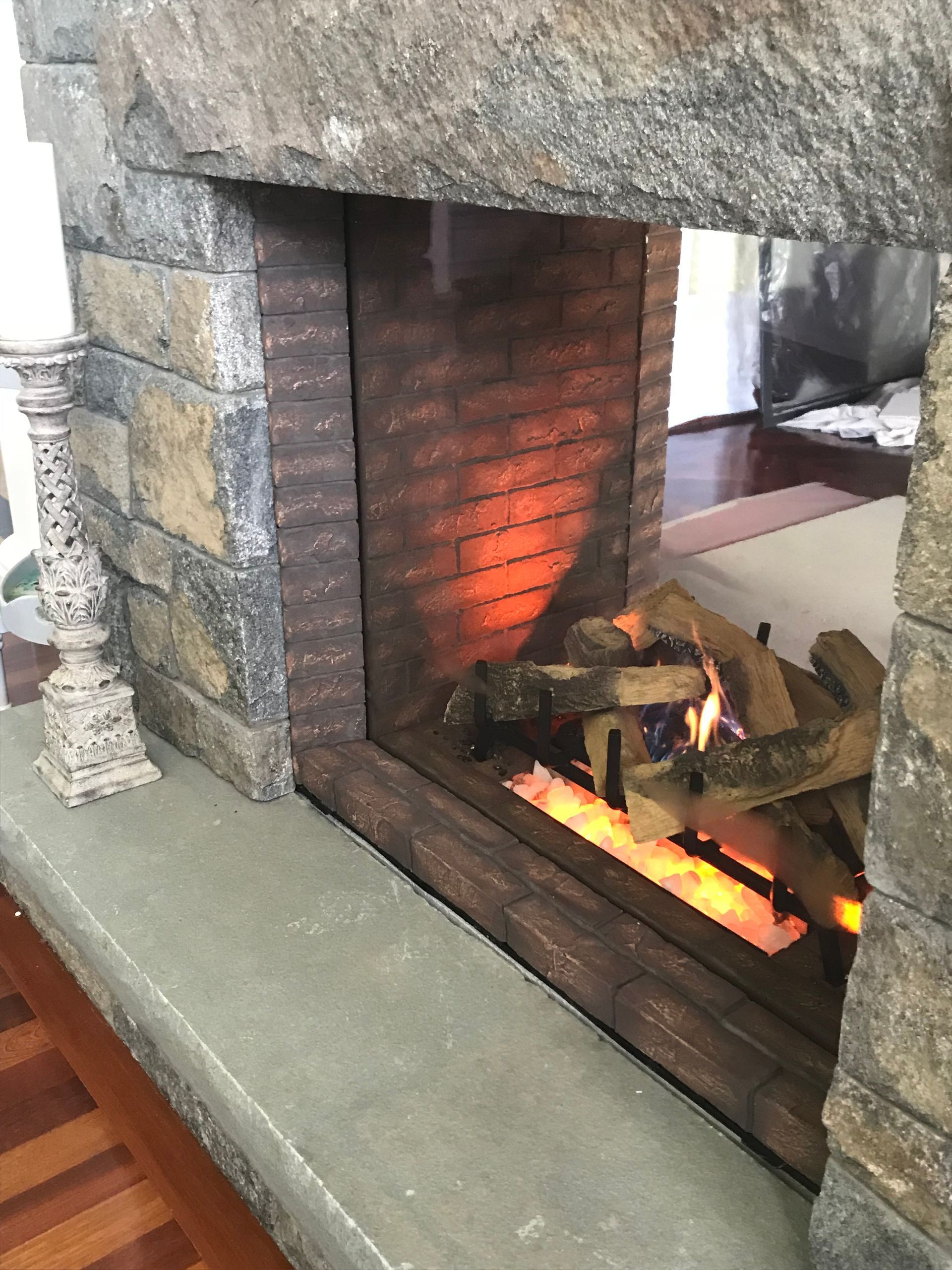 A fireplace with a lot of logs in it