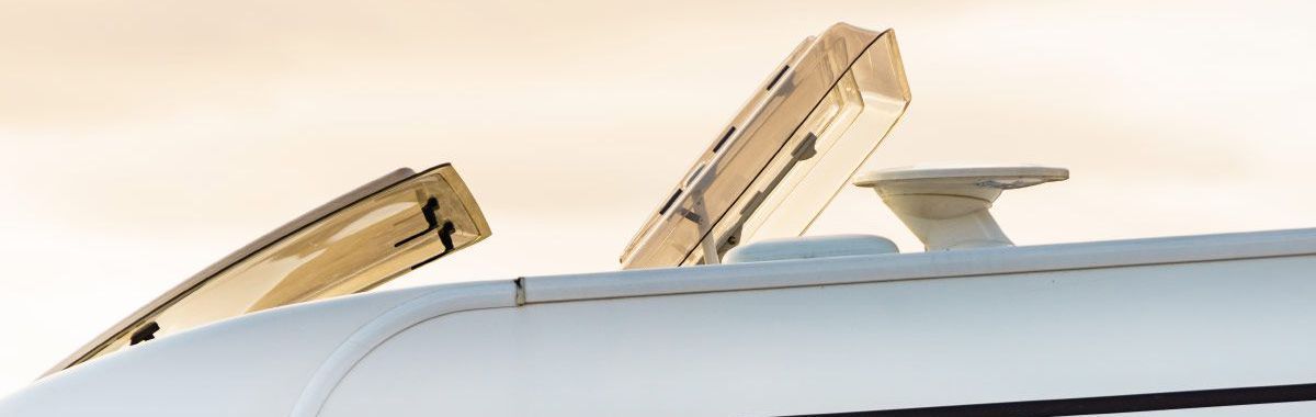 A close up of a plane 's cockpit with the windows open.