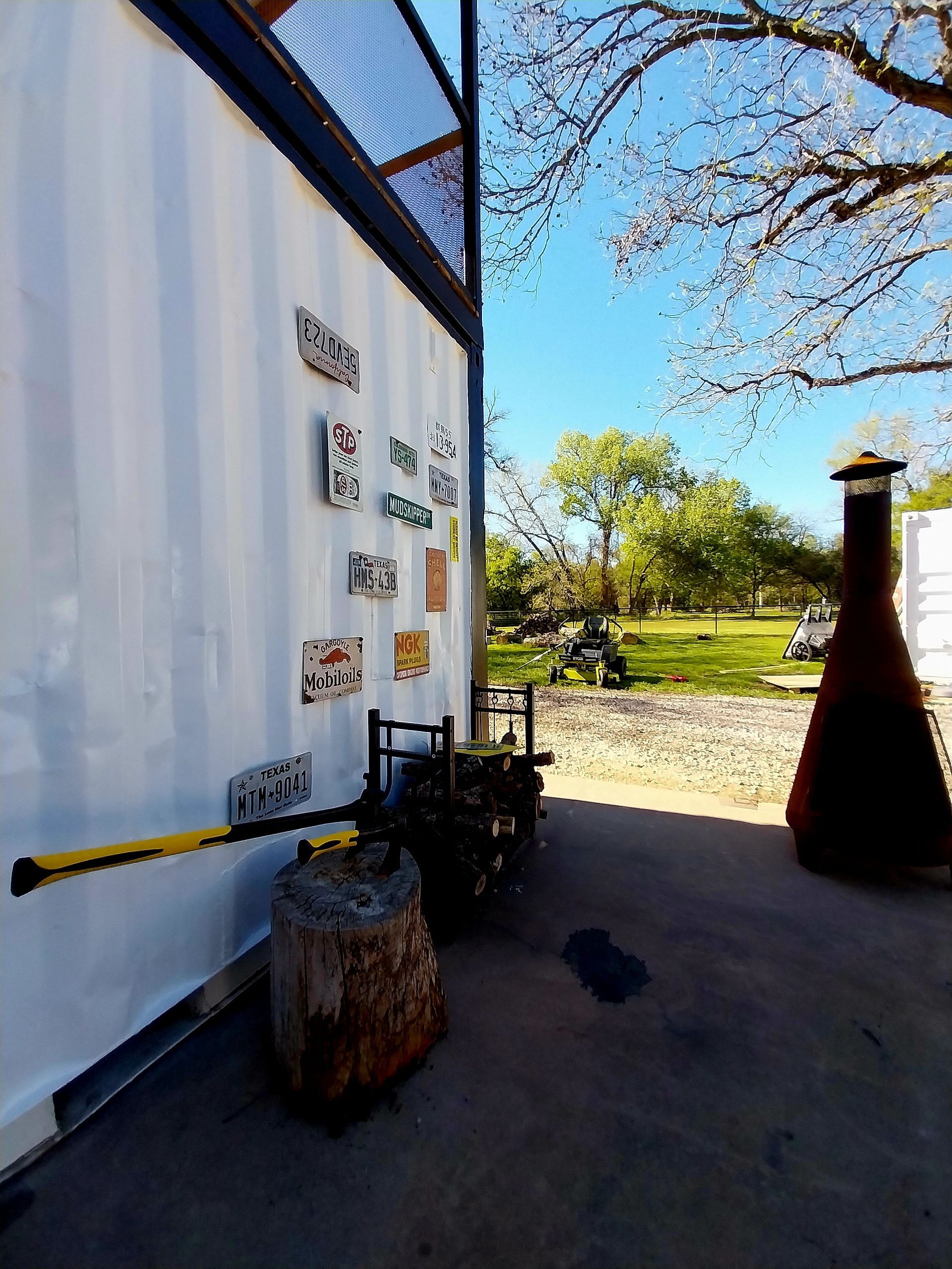 A white wall with a lot of signs on it