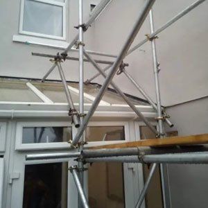 Scaffolding above a conservatory
