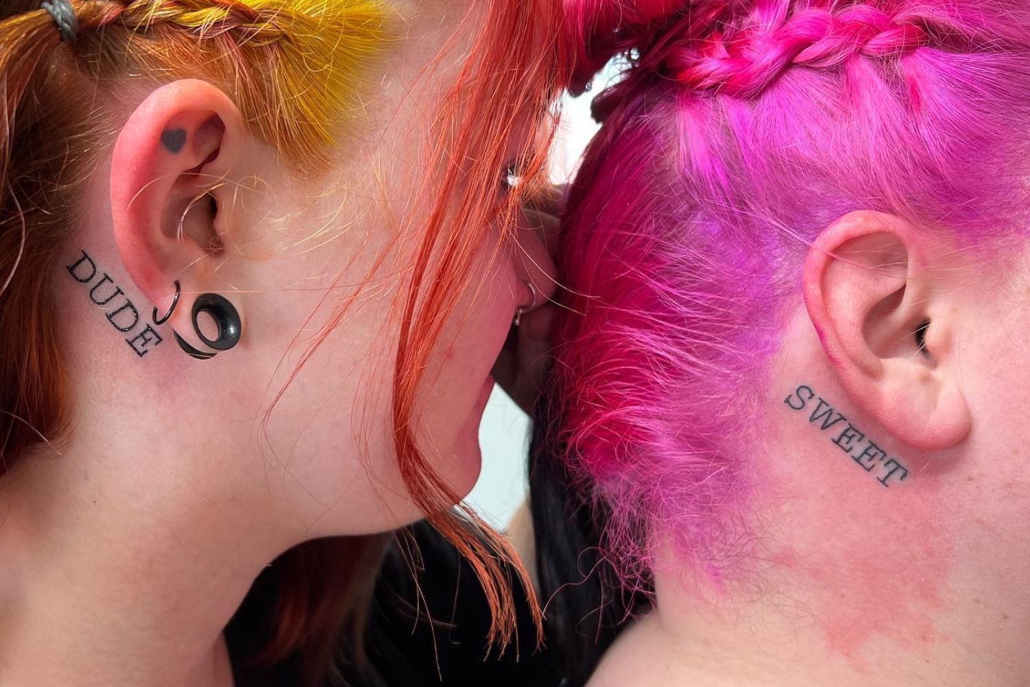 Women with tattoo under their ears