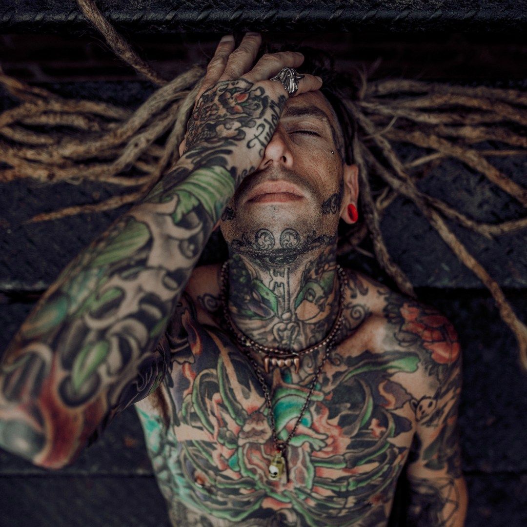 Man with piercing and tattoo