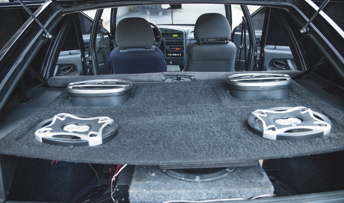 The back of a car with speakers and a subwoofer