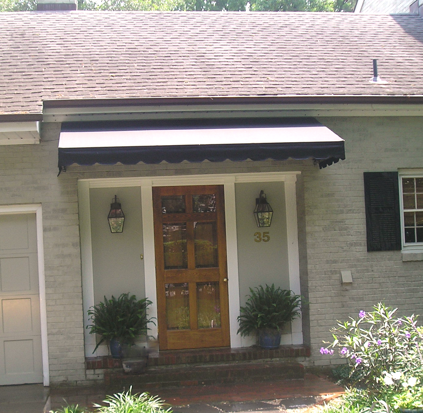 House with Striped Awnings — Norfolk, VA — Hustead's Canvas Creations