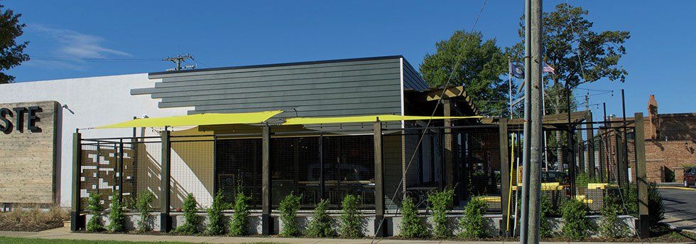 Building with Yellow Shade Sail — Norfolk, VA — Hustead's Canvas Creations