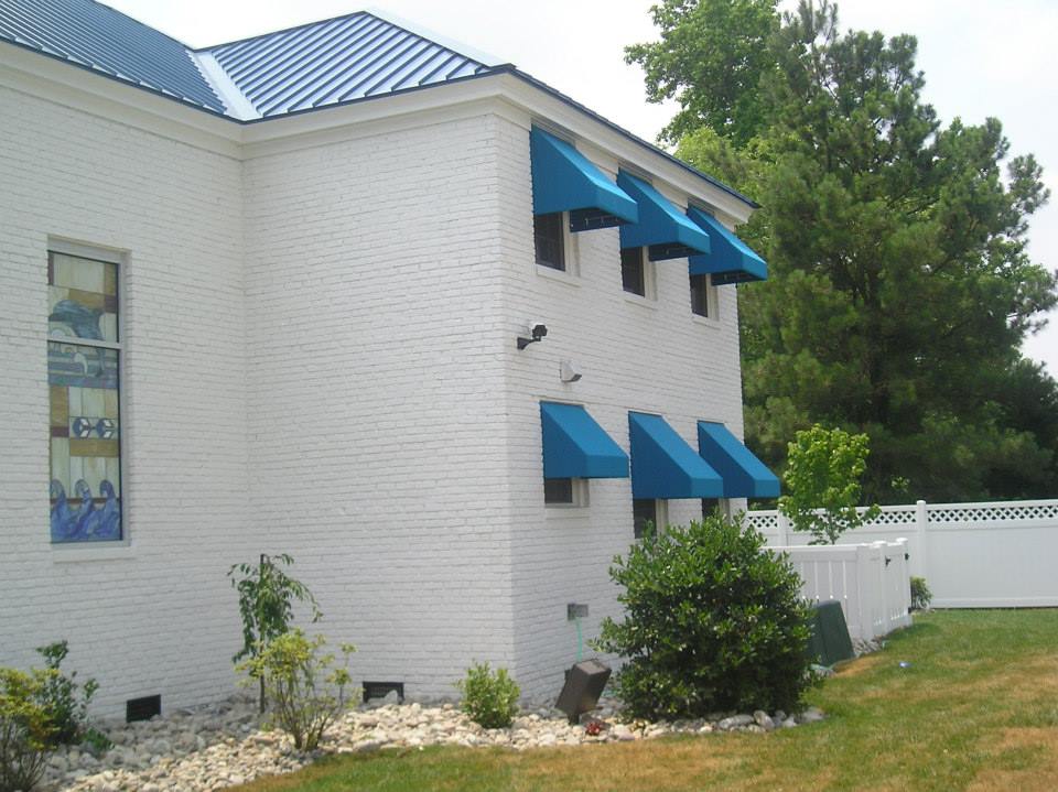 House with Blue Metal Canopies — Norfolk, VA — Hustead's Canvas Creations