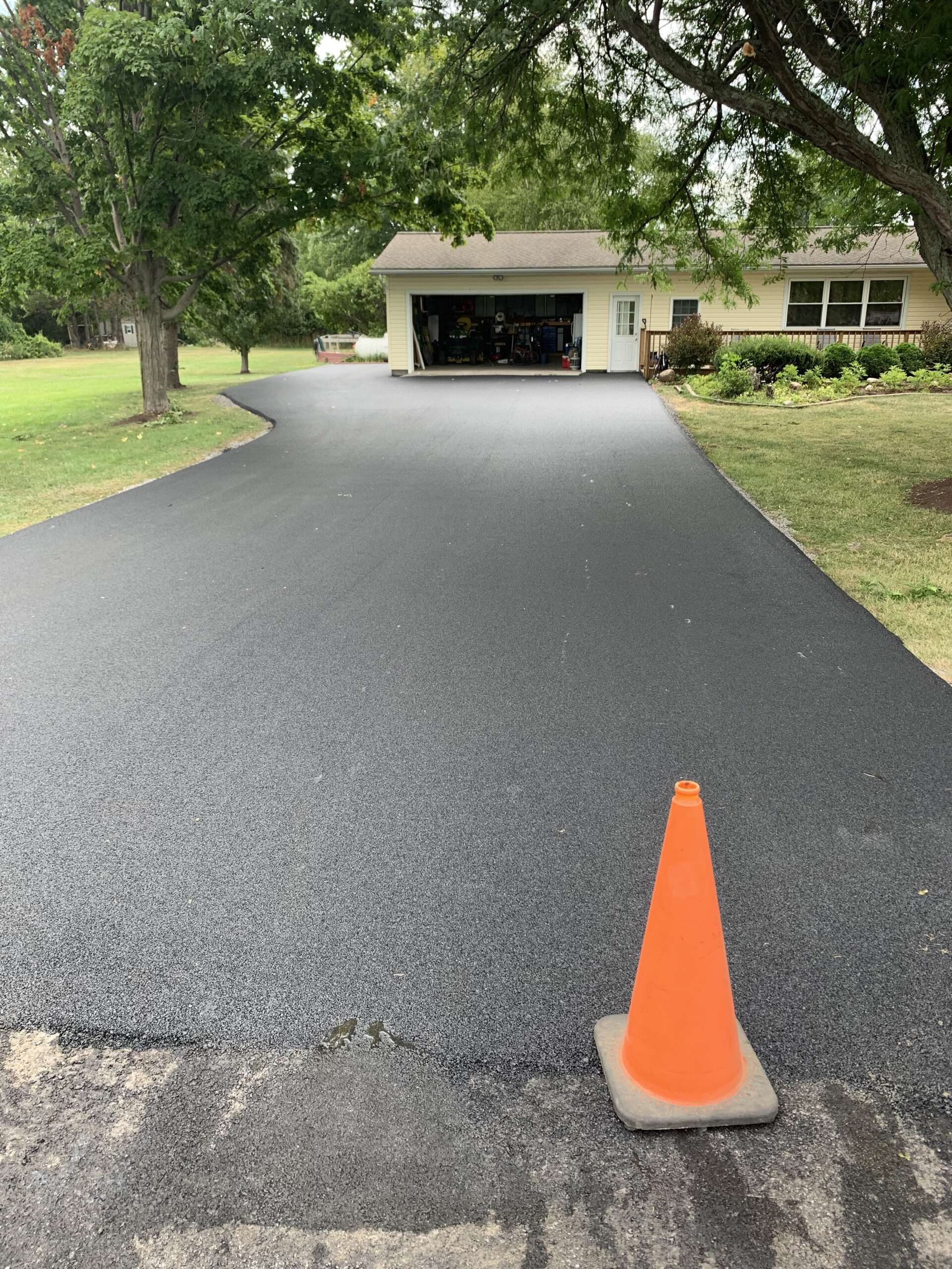 Beautiful Road With Traffic Cone — Finger Lakes — Cayuga Excavating & Paving