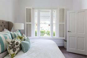 white shutters in a room