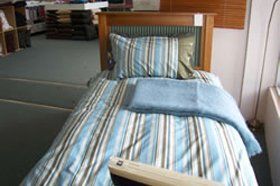 blue throw on a bed