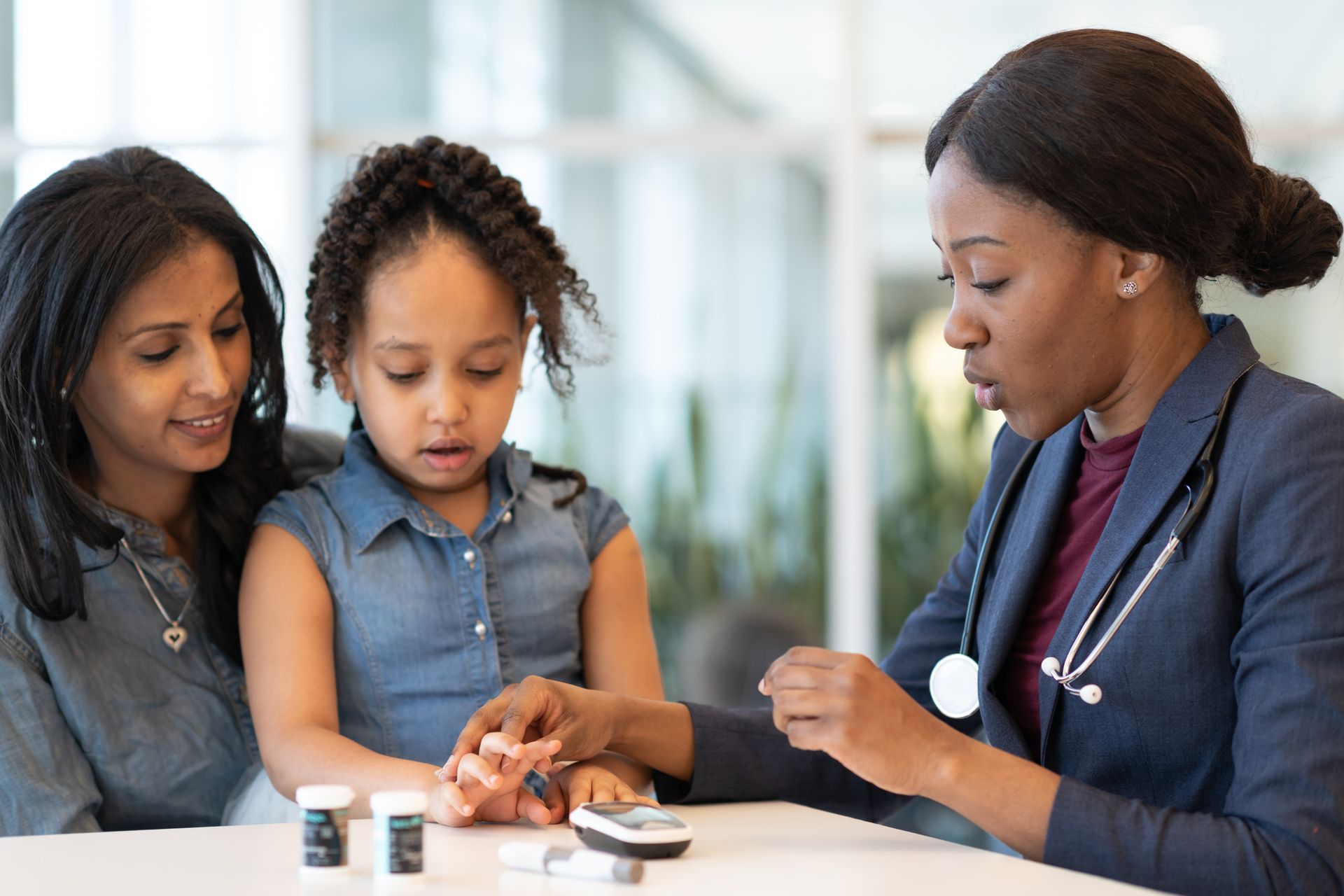 A doctor is helping a kid's hand.