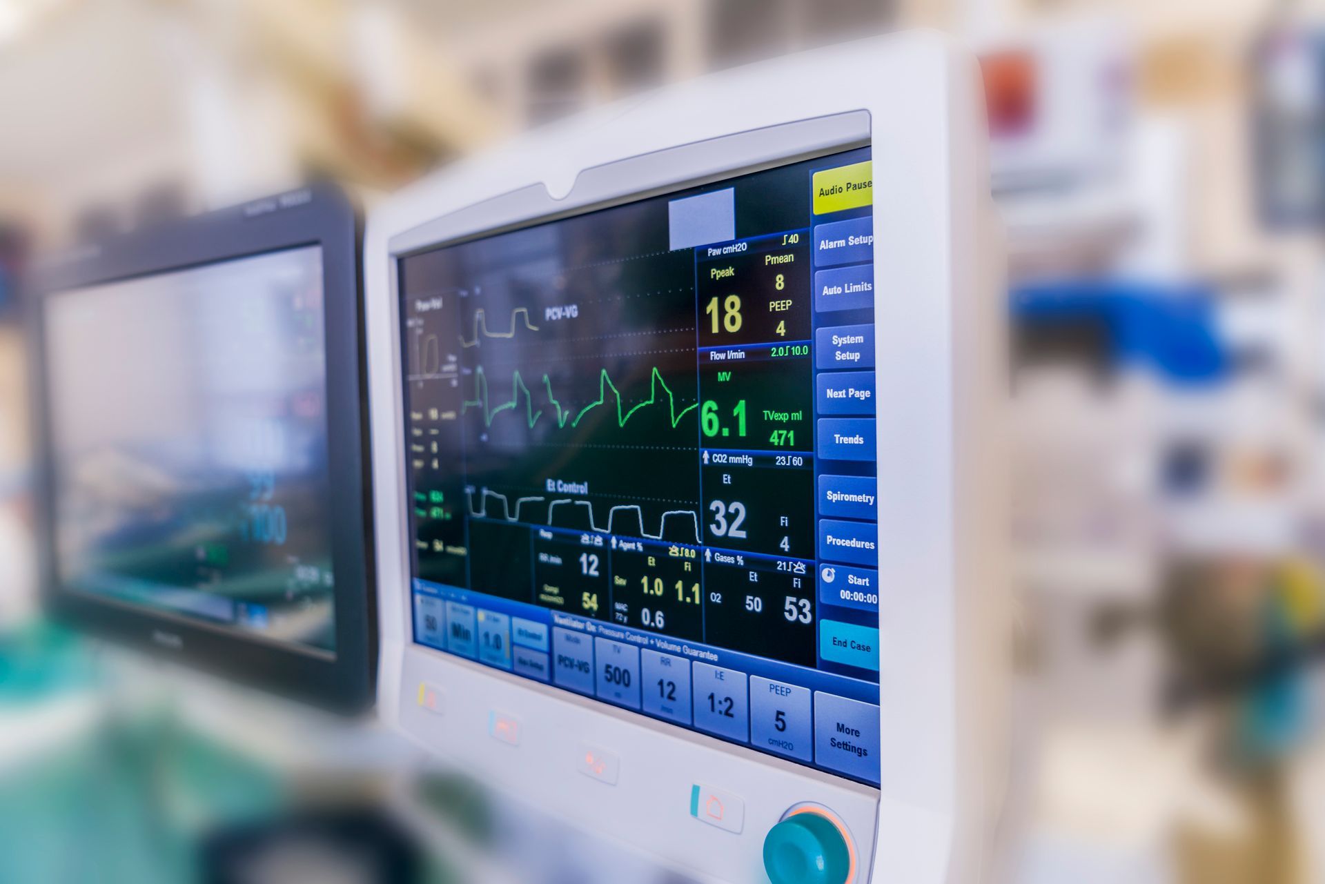 A close up of a medical monitor in an operating room.